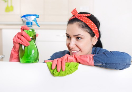 Technician performing hot water extraction on carpet