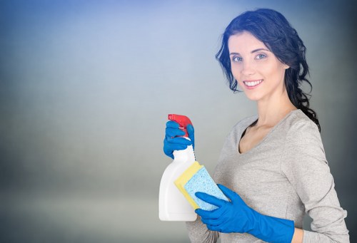 Supervisor checking safe working practices during carpet cleaning